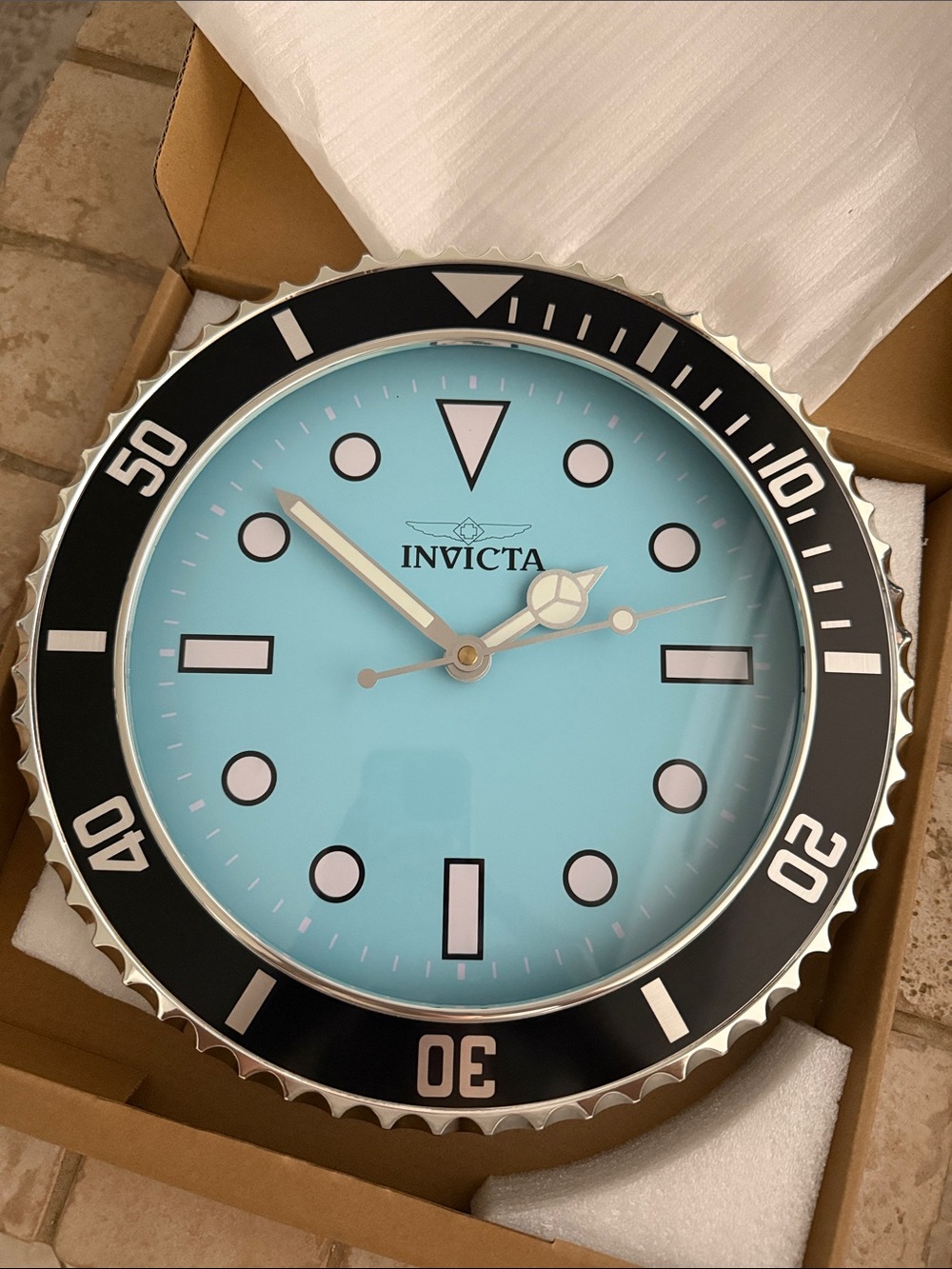 Invicta Aqua/Turquoise Wall Clock with Black Bezel